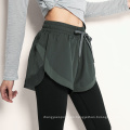 Pantalones deportivos de otoño Mujeres Dos piezas pantalones de yoga de fitness y pantalones cortos con bolsillo de teléfono interior